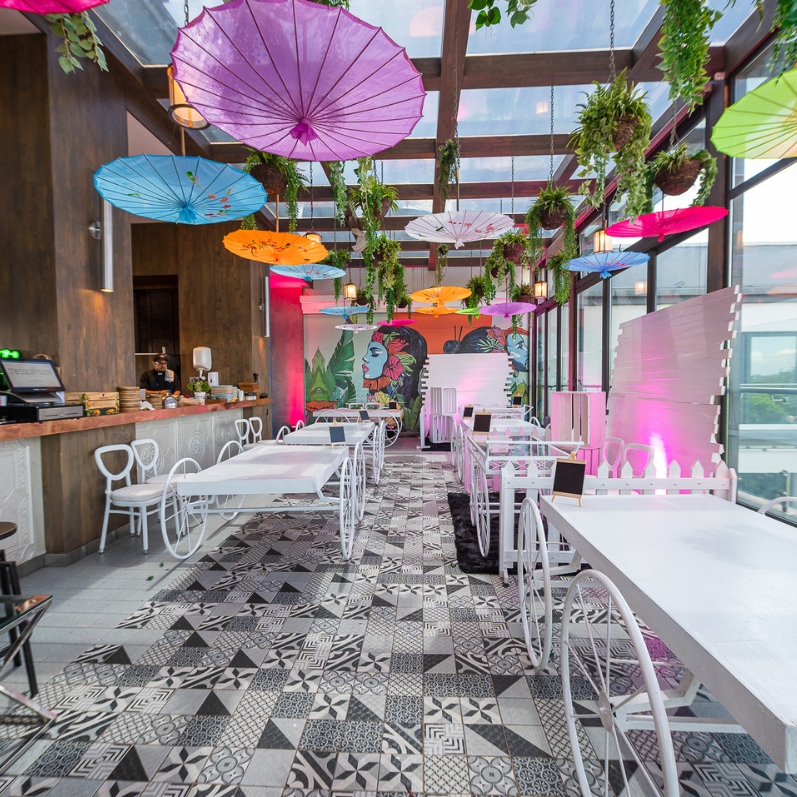 SJS Social House event venue setup with tables and lighting